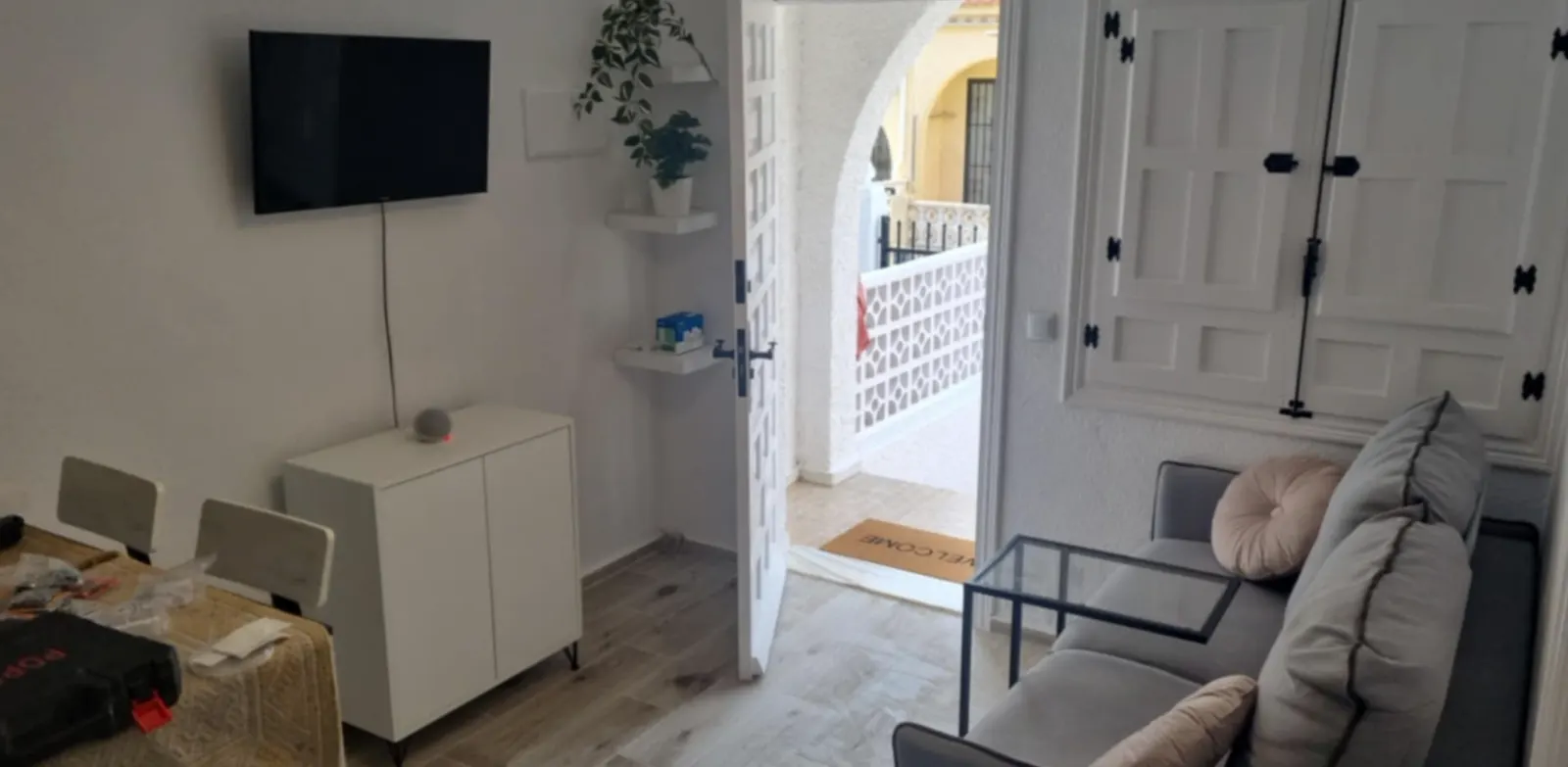 Bungalow living area with sofa and TV
